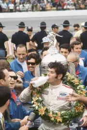 Indianapolis 500 Al Unser Sr Victorious drinking in Victory Lane w- Old Photo