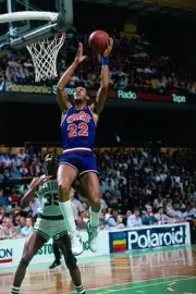 Larry Nance Cleveland Cavaliers shoots a layup v Reggie Lewis Bost- Old Photo