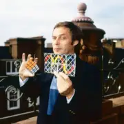 Erno Rubik poses two of inventions Rubik's Cube Rubik's Magic Lond- Old Photo 1