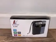 KNSTAR K-266 FM/AM AA/USB Powered pocket radio, built in speaker, New In Box
