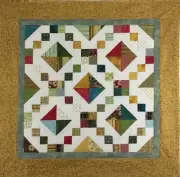Jewel Box Table topper/wall hanging quilt top, Machine pieced. Christmas fabric