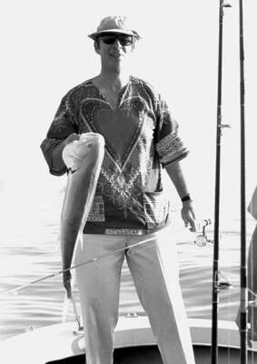 Man Stands In A Boat On Open Water Holding Jack Crevalle 1974 Old Fishing Photo