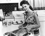 actress Natalie Wood as she prepares bacon while pancake cook on t- Old Photo