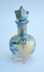 Gold Luster Perfume Bottle With Gold Wave Design. Saul Alcaraz