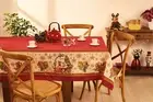 Christmas Tablecloth - Printed in red and cream with Santa Claus, ornaments star