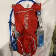 NEW - CamelBak Rouge Hydration Pack, 85 Oz. Reservoir Quick Fill 18” Length Red