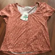 NWT Hippie Rose Short sleeved it’s a print floral T-shirt with buttons. Size L