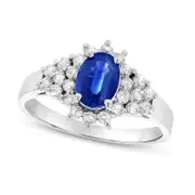 Oval Blue Sapphire and 0.33 CT. T.W. Natural Diamond Starburst Cluster Frame Ring in Solid 14K White Gold