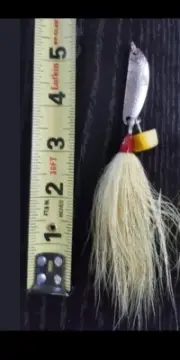 Side-Winder Jigging Spoons and treble hooks with White bucktail and 6/0 hooks.