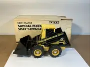 Vintage Ertl 1/16 scale die-cast New Holland skid-steer die-cast black/yellow