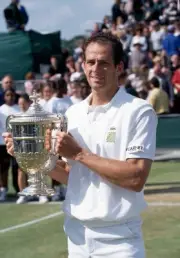 Guy Forget of France poses with the trophy after defeating Jeremy - Old Photo