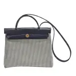 【HERMES 愛馬仕】HERBAG ZIP金色穿釦鎖頭造型帆布手提/肩背包(黑/米白色H082926-BLK-WHI)