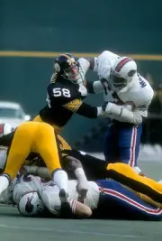 Reggie McKenzie in action v Jack Lambert Pittsburgh Steelers at a- 1974 Photo