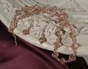 Handmade necklace/earring set in faceted rose beads with gold accents