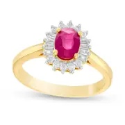 Oval Ruby and 0.20 CT. T.W. Baguette and Round Natural Diamond Starburst Frame Ring in Solid 10K Yellow Gold