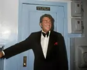 Dean Martin smiling in tuxedo backstage at Dean Martin Show set 8x10 inch photo