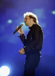 Musician Chris Martin of Coldplay rehearses ahead of The Brit Awar- Old Photo