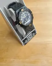 Black and Gold Vintage Analog/Digital Watch with Greenish White Round Indices