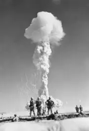 Marines taking part atomic tests Nevada Proving Grounds watch famil- 1952 Photo