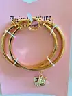Juicy Couture set of 2 goldtone stackable bangle bracelet w/ JC Logo