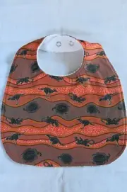 Handmade bib- Indigenous print on orange