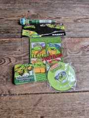 TMNT Merchandise Including: Pen, Magnets, Pin, And Magic Expanding Towel