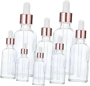 Mikinona 8Pcs Refillable Essential Oil Glass Bottles with Droppers Empty 20ml Bottles for Perfume Travel and Sampling Stylish Rose Cap