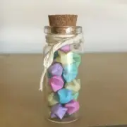Small decorative jar filled with handmade paper stars