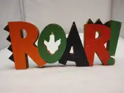 Kids' Multicolored Roar Wood Dinosaur Decoration by Hobby Lobby