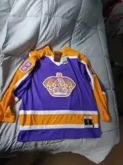 1980 Mitchell & Ness LA Kings Blue Line Jersey #18 Dave Taylor Yellow Mens XL
