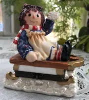 PORCELAIN HINGED TRINKET BOX - RAGGEDY ANN ON SLED