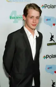 Actor Macaulay Culkin arrives at the launch of the uBid for Hurric - Old Photo 2