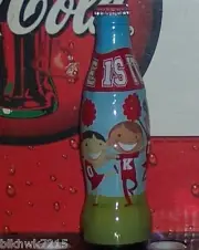 2011 WORLD OF COCA COLA CHEER COKE WRAPPED 8 OUNCE GLASS COCA COLA BOTTLE