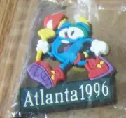 Atlanta 1996 Olympics Olympic Izzy mascot carrying the torch PVC lapel pin