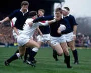Gary Armstrong of Scotland is tackled by Brian Moore of Englan- Old Rugby Photo