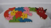 RARE! CUSTOM MEGAN'S PUZZLES COLORFUL WOODEN DINOSAUR PUZZLE 11 PCS NEW IN BOX