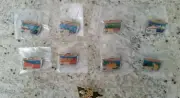 1998 - LOT OF 9 - 2000 OLYMPICS TORCH RELAY PINS - SOCOG / TROFE - NEW & SEALED