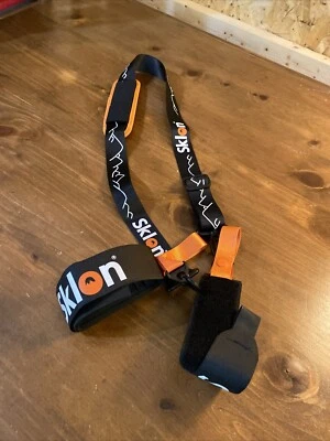 Ski Strap and Pole Carrier Features Cushioned Shoulder Sling Effortlessly