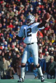 Quarterback Ken Stabler Oakland Raiders drops back to pass v the - 1976 Photo 1