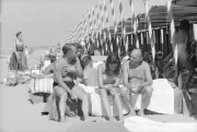 People sitting sunbeds relaxing beach during 19th Venice Internati- Old Photo