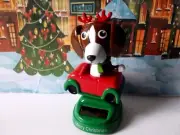 Solar Christmas Holiday Style Dog with reindeer antlers Sittng In A Car