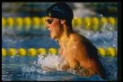 Jeremy Jaud swims at a race at the Janet Evans Invitational Swim M- Old Photo
