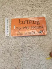 Inventive Travelware " Knitting My Way Around The World " Orange Luggage Tag
