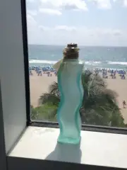 glass bottle with cork turquoise approximately 8.5"