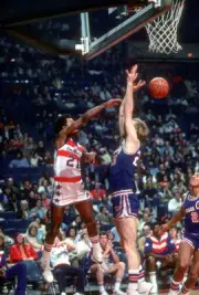 Dave Bing Washington Bullets passes the ball over the top of Jim - 1976 Photo