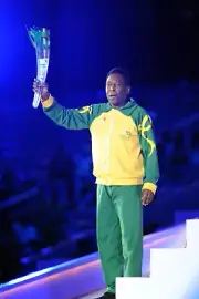 PELE HOLDING CEREMONIAL OLYMPIC TORCH SOCCER PLAYER AND MINISTER 4X6 PHOTOGRAPH