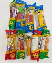 Lot 9 Sealed Pez Garfield Flintstone Woodstock Goofy Clown Kermit Tweety Mickey
