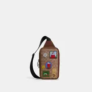 Coach X Peanuts Sullivan Pack In Signature Canvas With Patches