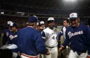 Atlanta Braves Hank Aaron shakes hands with teammates following a - Old Photo