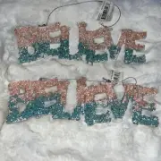 Two Wood Ornaments With The Word “BELIEVE“ Pink And blue (Temptation Store)